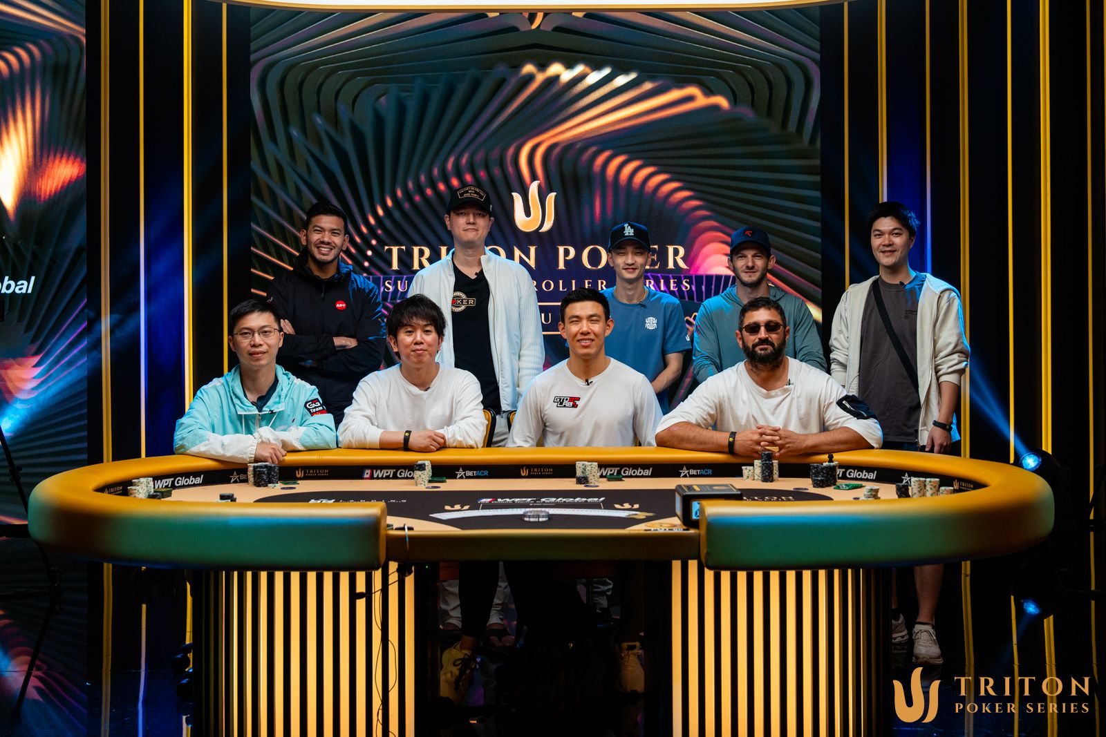Event 2 final table players (clockwise from back left): Michael Soyza, Chi-Jen Chu, Edward Pak, Jonathan Jaffe, Clemen Deng, Ramin Hajiyev, Brian Kim, Masashi Oya, Mao Renji.